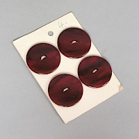 4 Knöpfe auf Verkaufskarton
